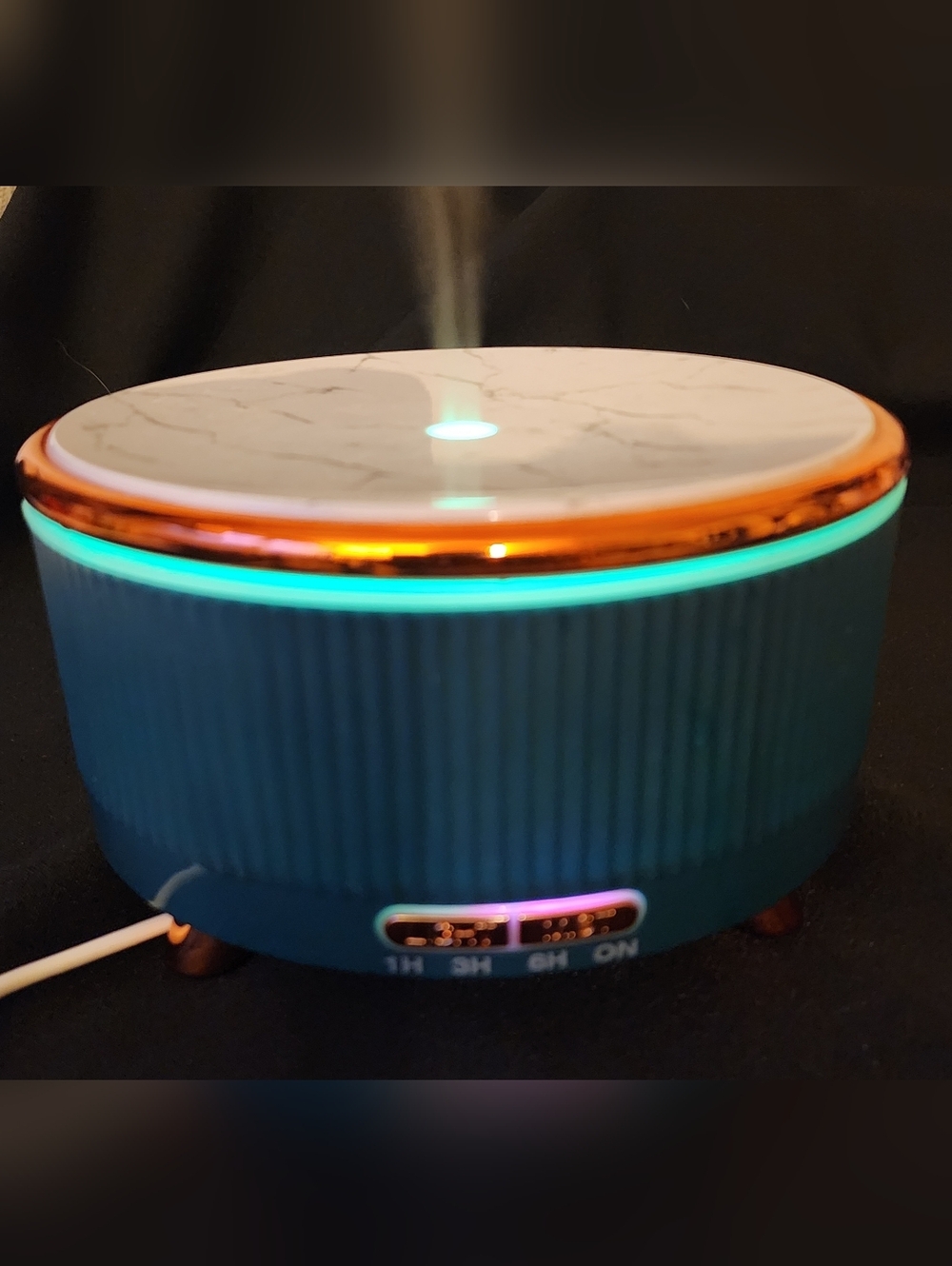 Teal Blue Ultrasonic Aroma Diffuser with Marble Design Top.